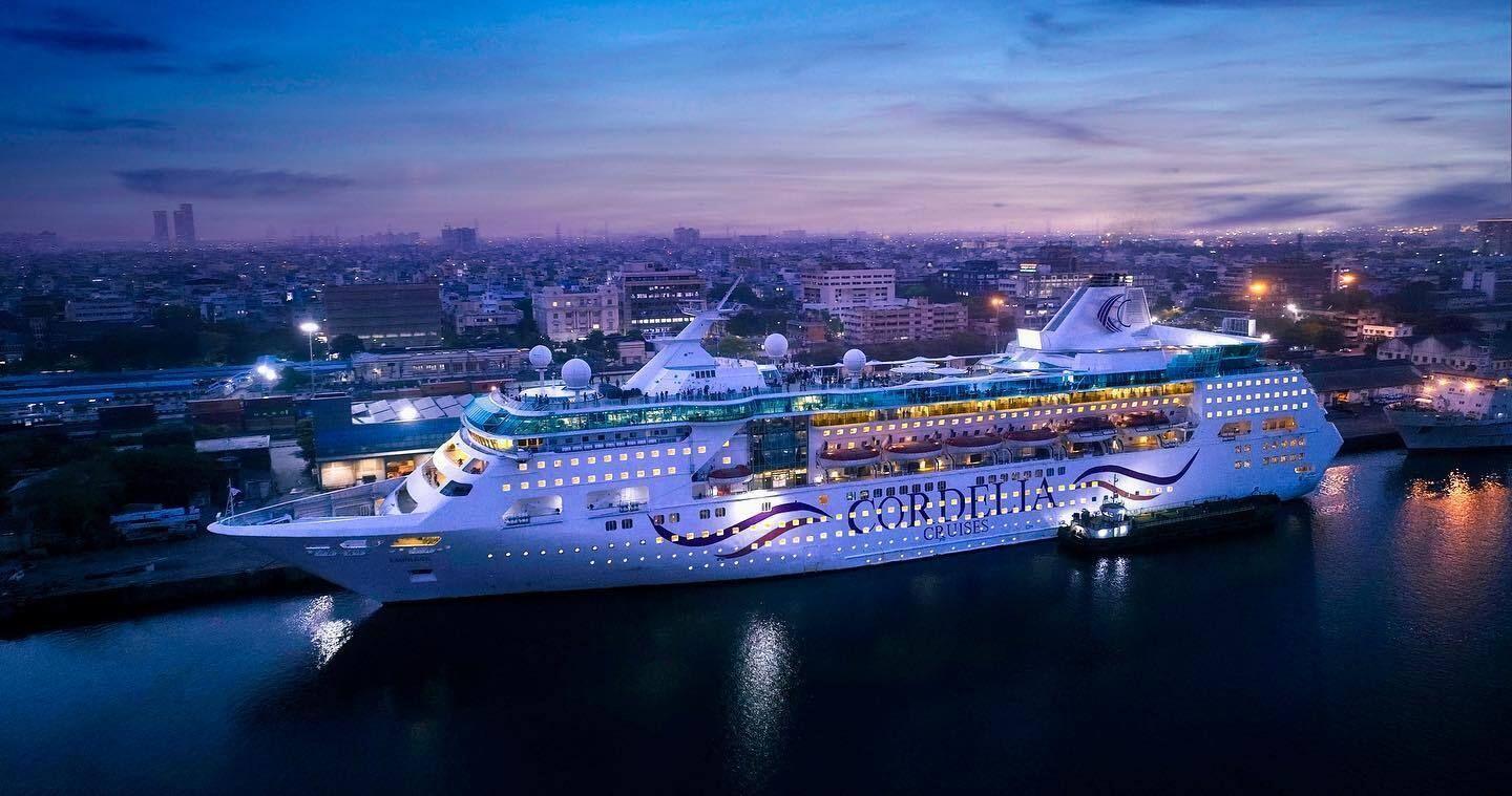 Cruise tourism vessel docked at scenic coastal port